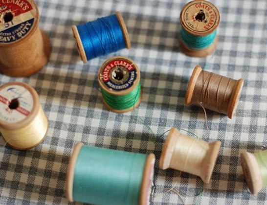 wooden thread spools to hooks before