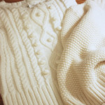 Stone Gable sweater pillow before